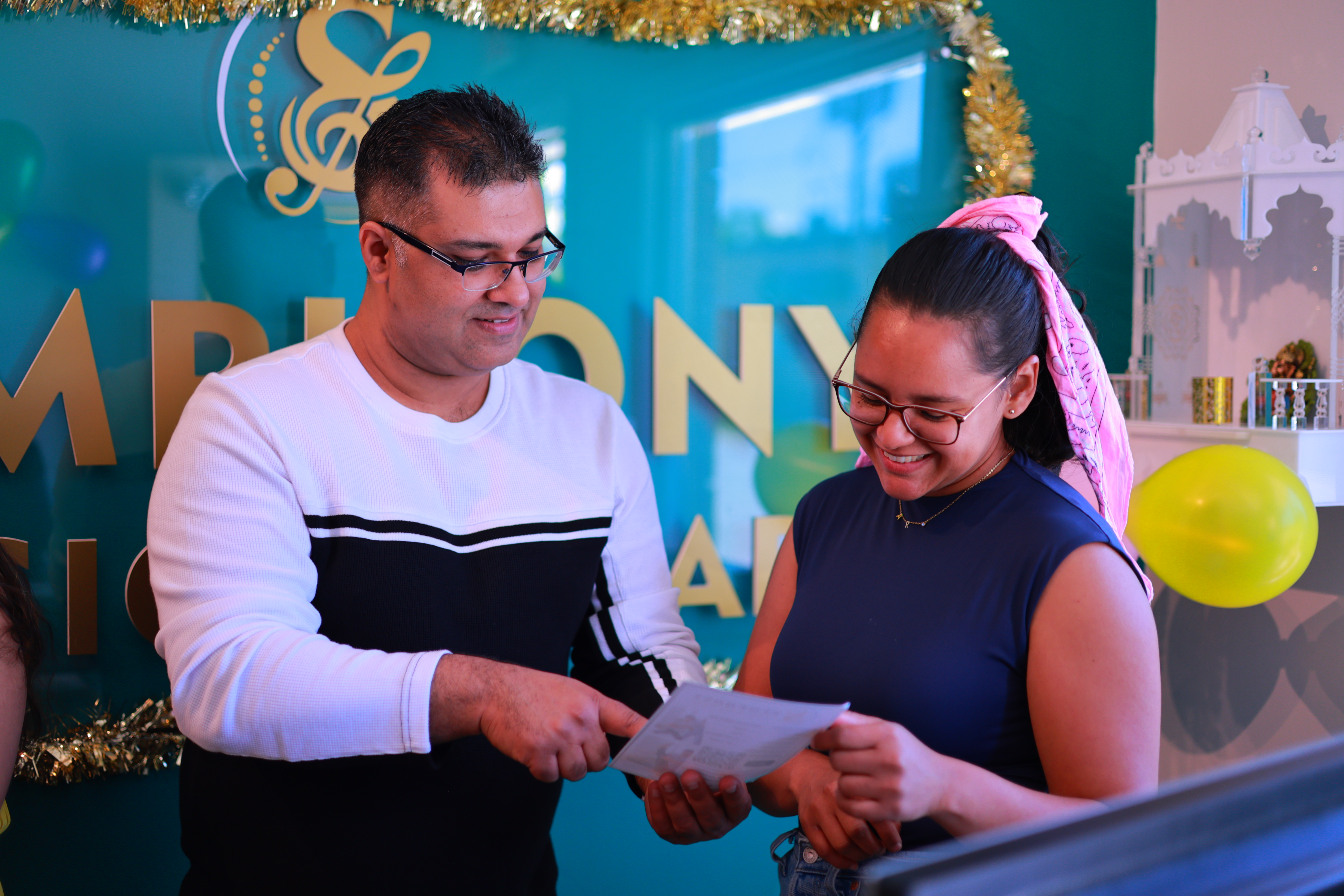 Symphony Physiotherapy Beaverton grand opening certificate presentation moment